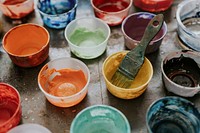 Paint mixing cup with various colors 