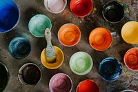 Paint mixing cup with various colors 