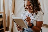 Woman artist sketching in her studio 