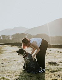 Woman with dog at a Scottish farm