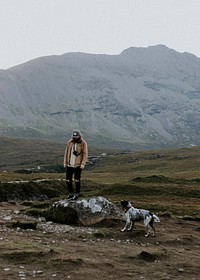 Man with dog in rugged nature