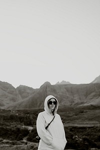 Woman in hoodie, moody background