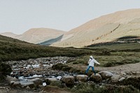 Traveler in the Scottish Highlands, beautiful rugged nature 