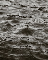 Deep dark water background, grayscale 