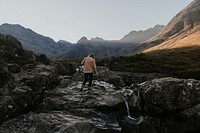 Travel background, man in rugged nature