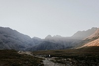 Traveler in the Scottish Highlands, beautiful rugged nature 