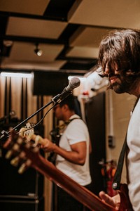 Musician playing electric guitar, aesthetic photography