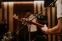 Musician playing guitar background, aesthetic photography