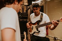 Music band guitarist performing repetition in recording studio