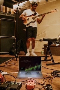 Musician playing bass repetition, studio recording session stock image