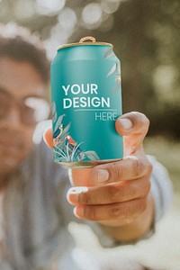 Soda can psd mockup held by a man