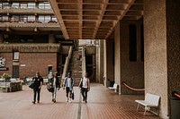 Happy friends walking film photography inside the building