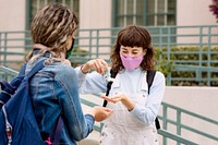 Students wearing mask at school, and using alcohol gel in the new normal 