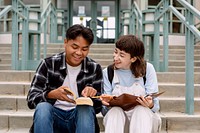 Diverse students studying together at college campus