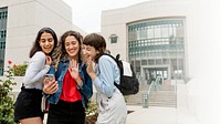 College girls video calling with friends at campus