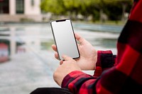 Student holding blank mobile phone screen