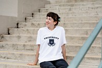Student wearing university tee at campus, college apparel