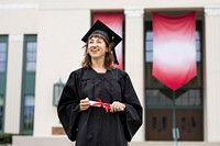 Girl graduating college, celebrating academic achievement 