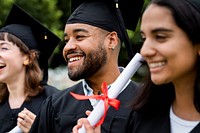 Happy diverse students graduating university, celebrating with diplomas