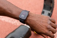 Black smartwatch with heart rate tracker psd on a man's wrist 