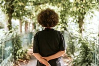 Woman walking in a park, rear view