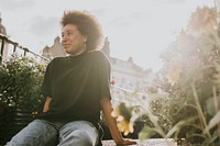 Woman smiling in a home garden, new normal hobby