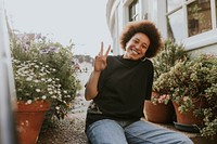 Woman smiling in a home garden, new normal hobby