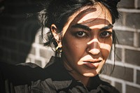 Indian woman fashion shoot by the brick wall 