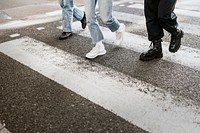 Friends crossing the zebra cross on the road