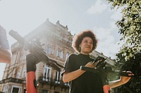 African American woman renting electric scooter