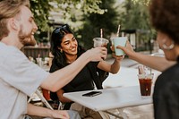 Friends having a coffee and talking at a cafe