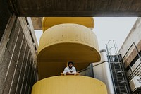 Male skater at yellow stairs