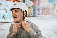 Cheerful man wearing white helmet, sports safety equipment