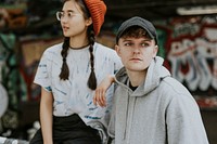 Man in gray hoodie and woman in tied dye tee