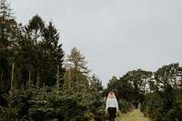 Woman at a Christmas tree farm 