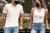 Couple wearing face masks, with physical distancing