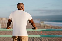 African American man looking at the distant Venice beach 