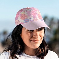 Pink cap mockup psd, Latina woman by the beach