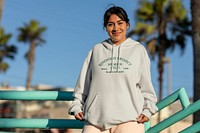 Streetwear apparel mockup, psd hoodie top, young woman at the Venice beach