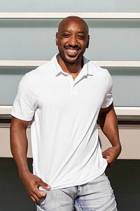 Confident African American man, wearing a plain white polo shirt