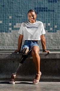 Happy African American amputee person wearing a prosthetic leg