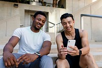 Two men friends using the smartphone