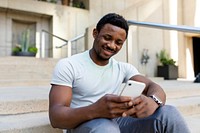 African American man texting on a phone