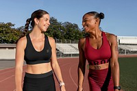 Sports bra and shorts mockup psd on athletic runner friends talking and walking on the track