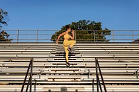 Woman athlete doing workout at the bleachers
