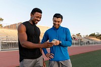 Two men looking at a phone