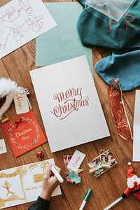 Christmas card mockup psd, on wooden floor, festive stationery