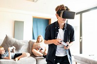 Young boy playing VR game at home