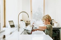 Boy washing dishes, basic house chores