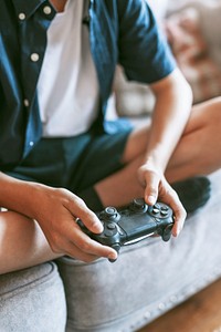 Boy playing video game in living room